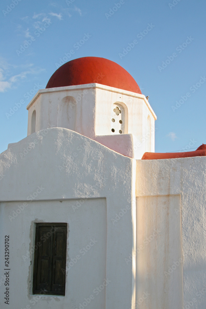 Traditional whitewashed church with a red roof, Mykonos, Cyclades, Greece.