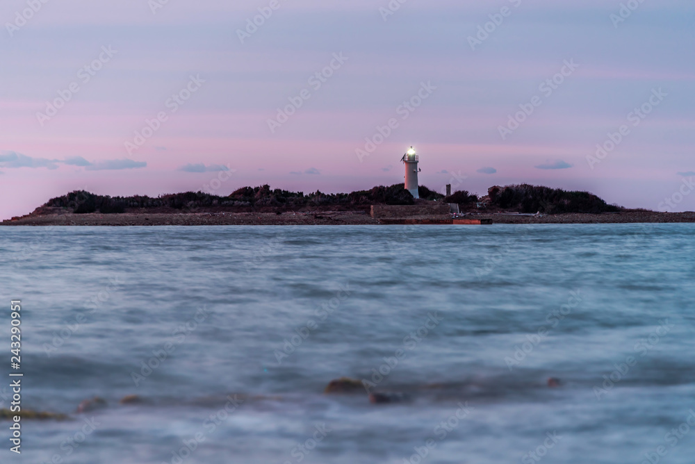 Long Exposure at Sunset on the Southern Italian Mediterranean Coast with Lighthouse