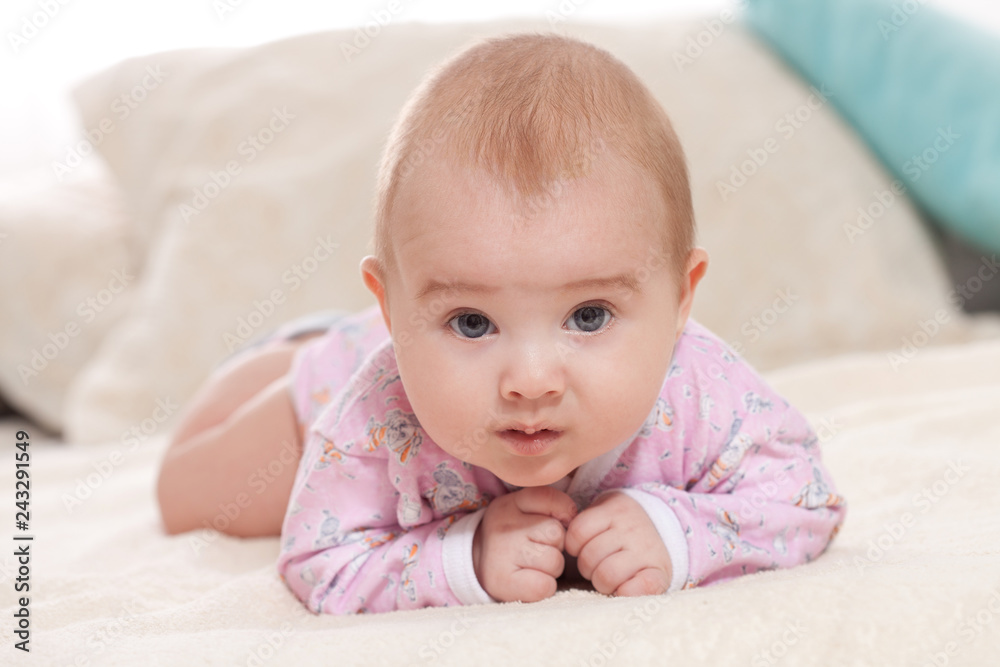 children, people, infancy and age concept. beautiful happy baby on light background at home