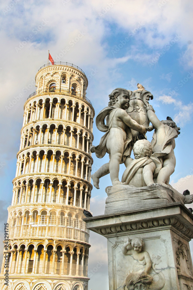 Leaning tower of Pisa with the statue of cherubs, Pisa, Tuscany, Italy.