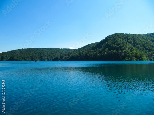 Beautiful landscape with views of the two River boat floating on the lake in the national Park Plitvice lakes, Croatia.