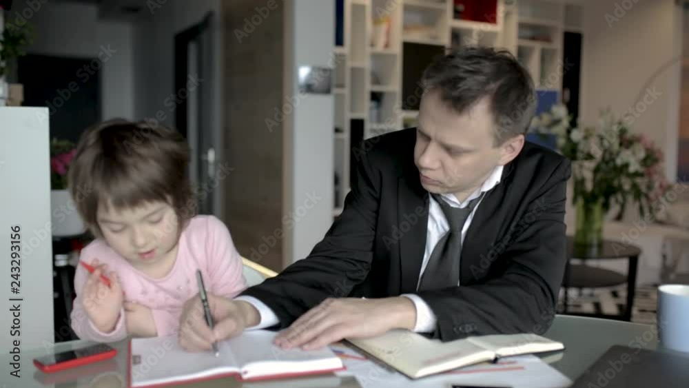 Daughter helping father working at home Daughter helping father working at home
