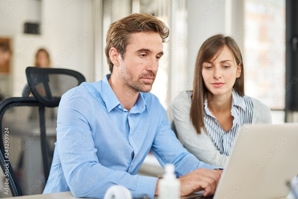 Two people in start up office, brainstorming about problems they encounter Two people in start up office, brainstorming about problems they encounter