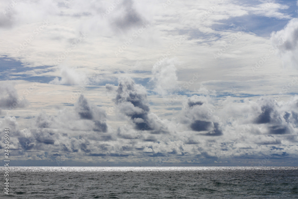different clouds over the ocean