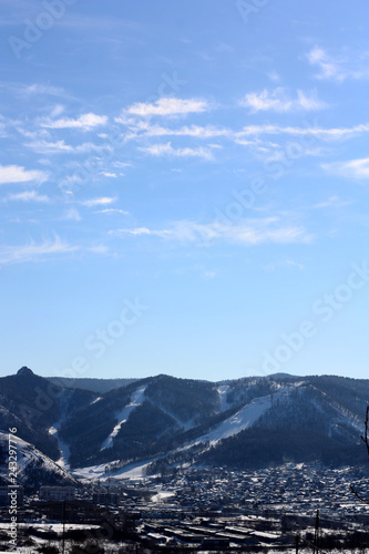 lanscape sky and snow covered rocks ski slope © epovdima