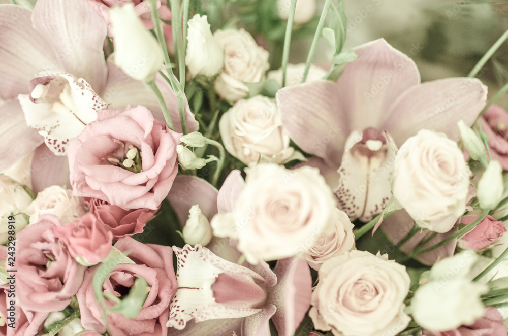 Bouquet with orchids and roses on a beautiful background Bouquet with orchids and roses on a beautiful background