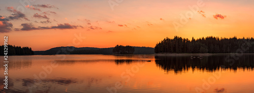Fototapeta Naklejka Na Ścianę i Meble -  Golden lake sunset panorama / Panoramic view with golden lake sunset in Rhodope Mountains, Bulgaria