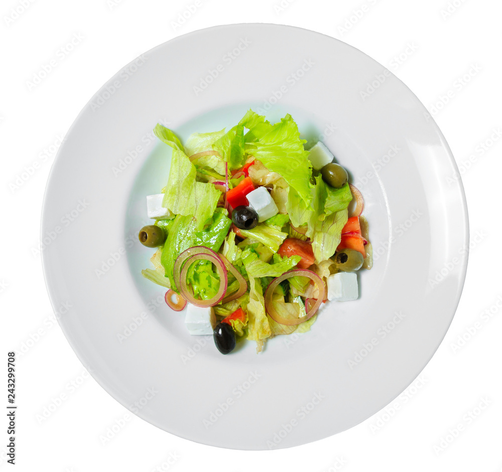 Greek salad with olives, onion, feta cheese, romaine lettuce and tomatoes on a plate.