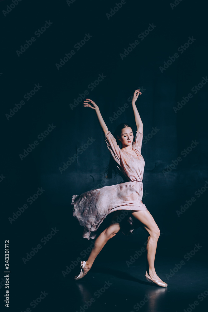 Ballerina in the rehearsal room rehearsing dance