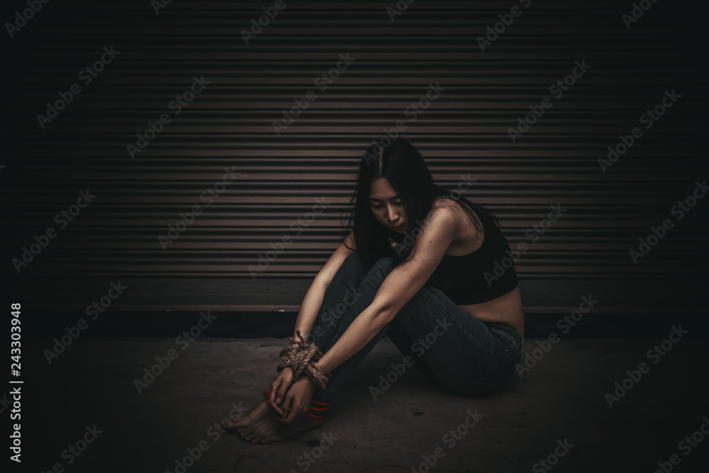 Asian hostage woman Bound with rope at night scene,The thieves ...