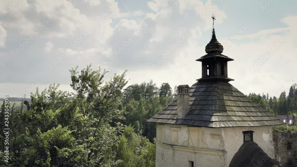 Monumental view from castle battlements to landscape with hills, forests and fields. Holiday sunny positive mood. Monumental stone historic building Monumental view from castle battlements to landscape with hills, forests and fields. Holiday sunny positive mood. Monumental stone historic building