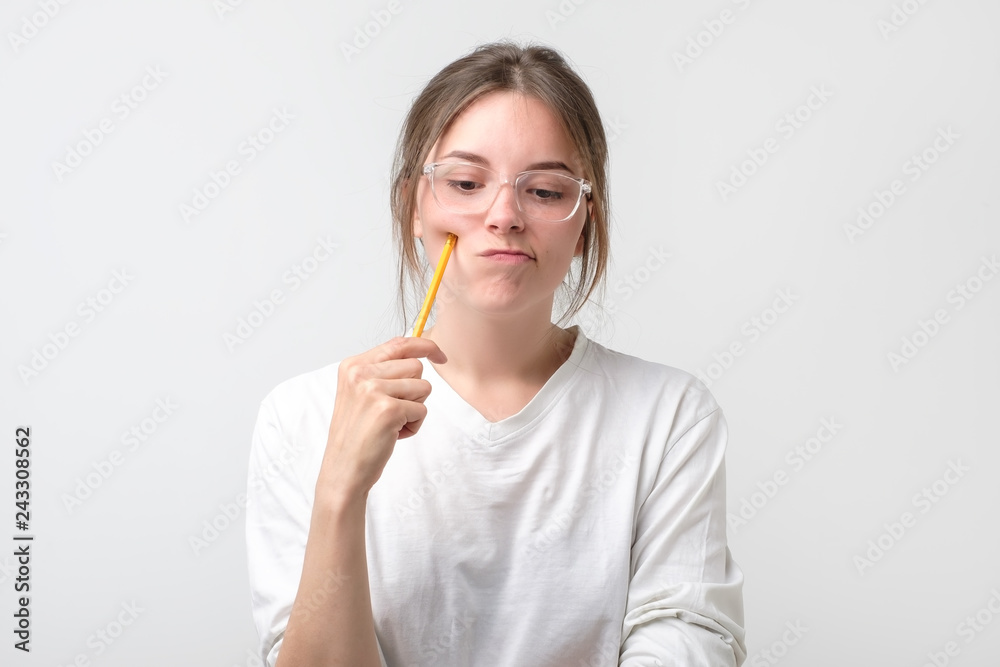 irl is thinking about exams holding pencil irl is thinking about exams holding pencil