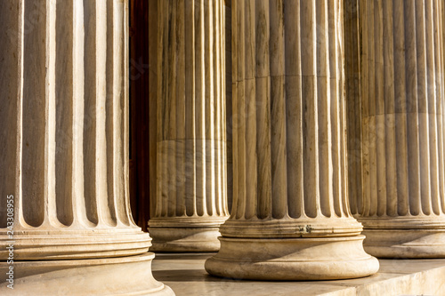 Classical marble pillars detail on the facade of a building