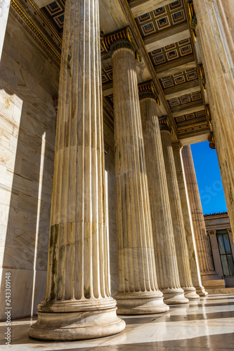 Classical marble pillars detail on the facade of a building