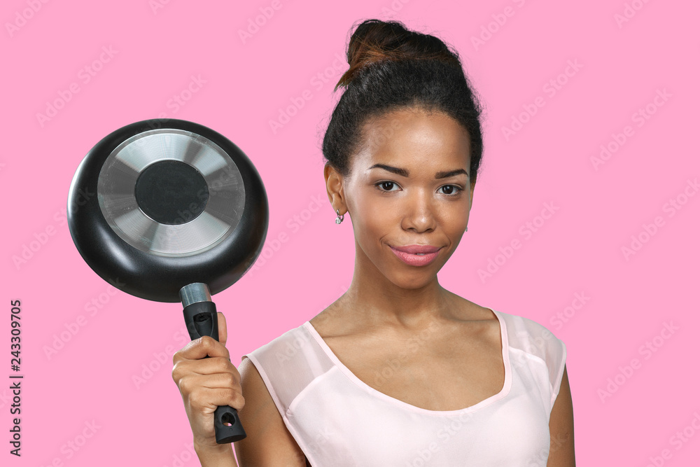 African american woman holding kitchen utensils African american woman holding kitchen utensils