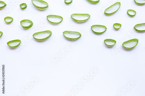 Aloe vera slices on white background.