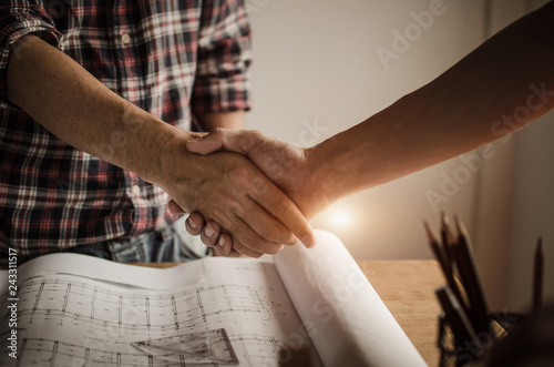 hand of construction worker team contractor handshake after finishing up a business meeting to greeting start up project contract in construction site building, teamwork partnership concept