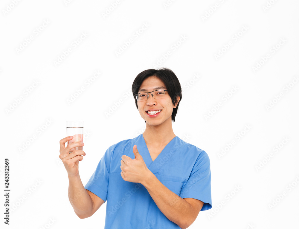 Smiling asian man doctor wearing uniform standing Smiling asian man doctor wearing uniform standing