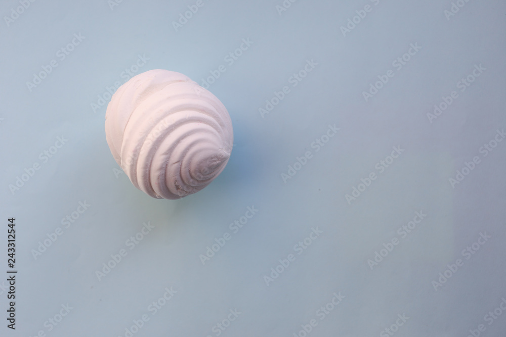 White marshmallows on blue background. Flat lay, copy space White marshmallows on blue background. Flat lay, copy space