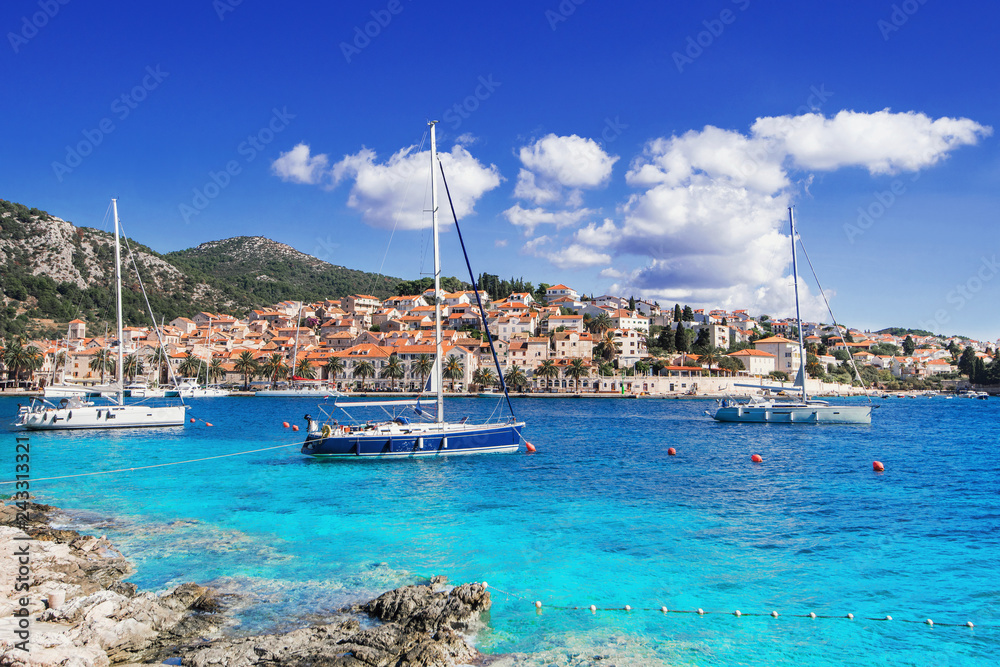 Sailing boats in a beautiful bay of the Hvar island, Dalmatia, Croatia