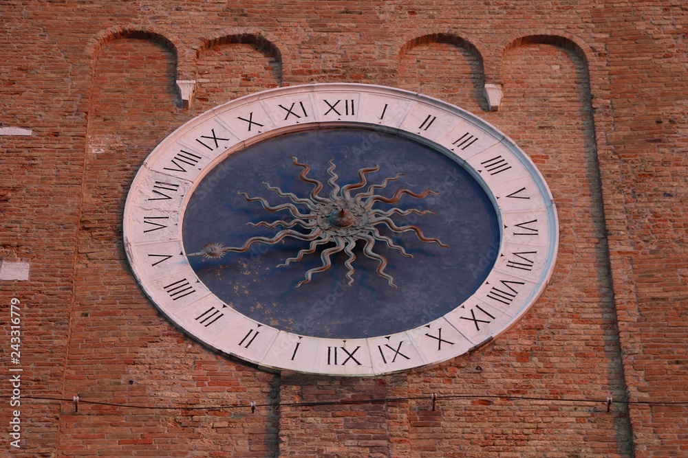 Chioggia, Veneto, Italy. Clock of the bell tower of S.Andrea, It is the oldest functioning medieval clock in the world.