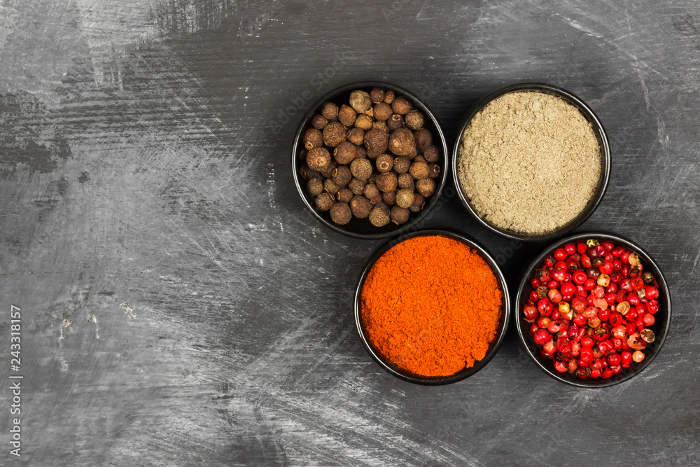 Various pepper on a black background. Top view, copy space. Food background Various pepper on a black background. Top view, copy space. Food background