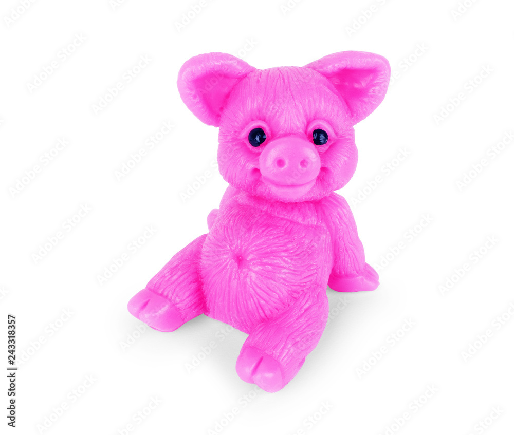 Soap in the shape of a pig, the year of a pig, pink toy pig on a white background Soap in the shape of a pig, the year of a pig, pink toy pig on a white background