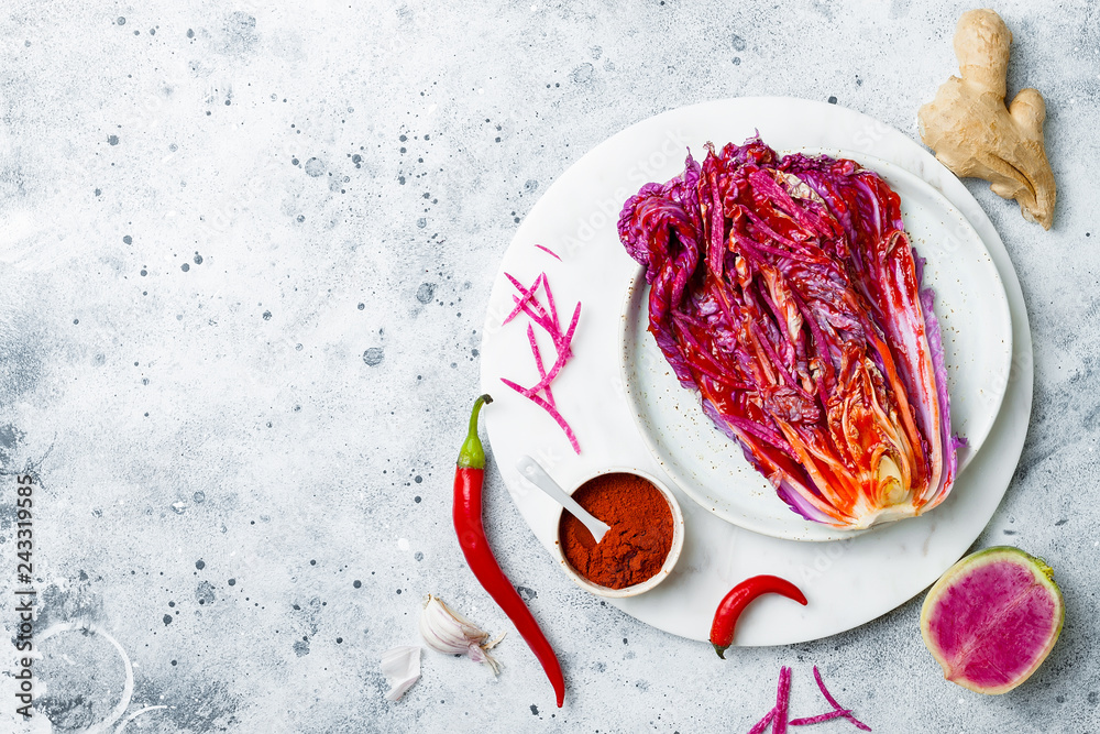 Cabbage kimchi, top view. Preparing purple cabbage and watermelon radish kimchi. Fermented and