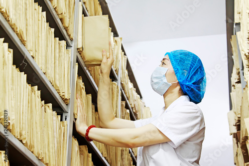 medical and health personnel looking for medical records shelf, luannan county, hebei province, China photo