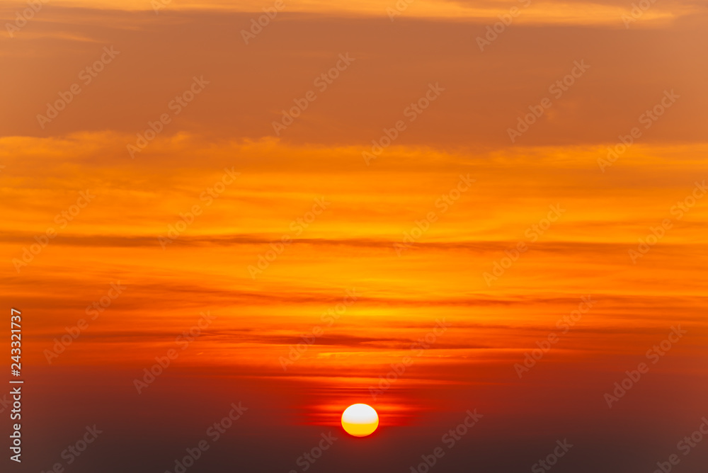 Beautiful blazing sunset landscape and orange sky above it. Amazing summer sunrise as a background.