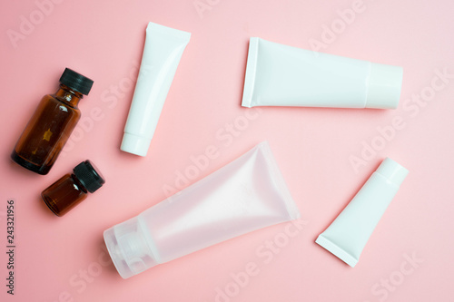 flat lay with cosmetic products tubes branding