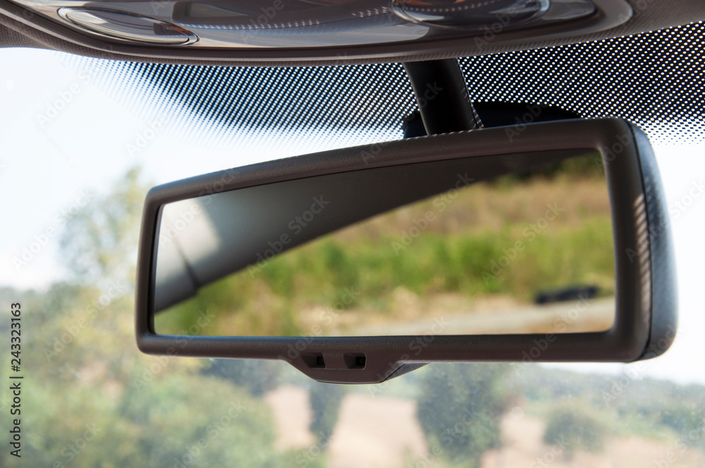 Fototapeta premium Car rear view mirror inside the car.
