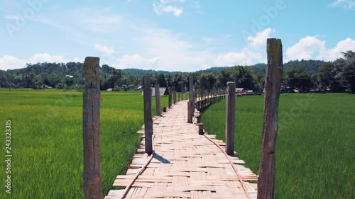 Wooden bridge in the rice field in Thailand. Su Tong Pae Bridge photo