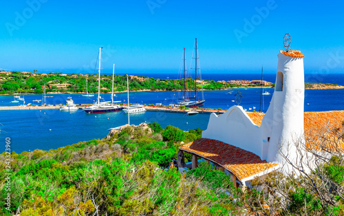 View of Porto Cervo and Stella Maris church, Italian seaside resort in northern Sardinia, Italy. Centre of One of the most expensive resorts in the world. photo