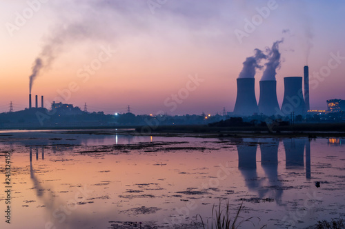 Canvas Print Cooling tower and smoke chimney emitting steam and smoke
