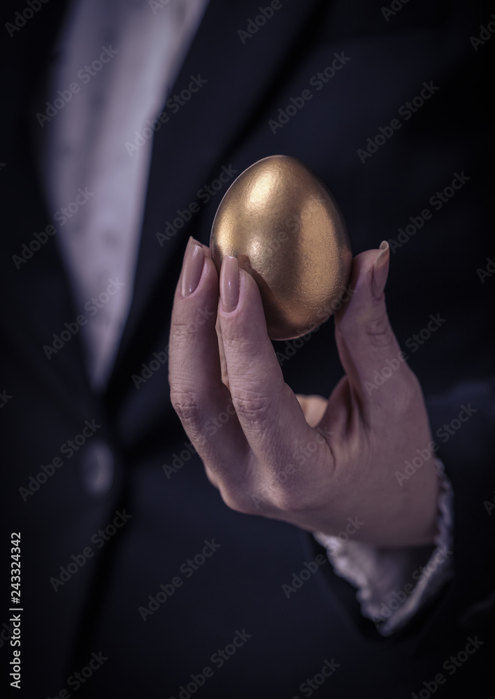 golden egg in female hand