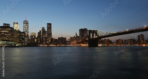 View from the sea on the evening of New York and the bridge
