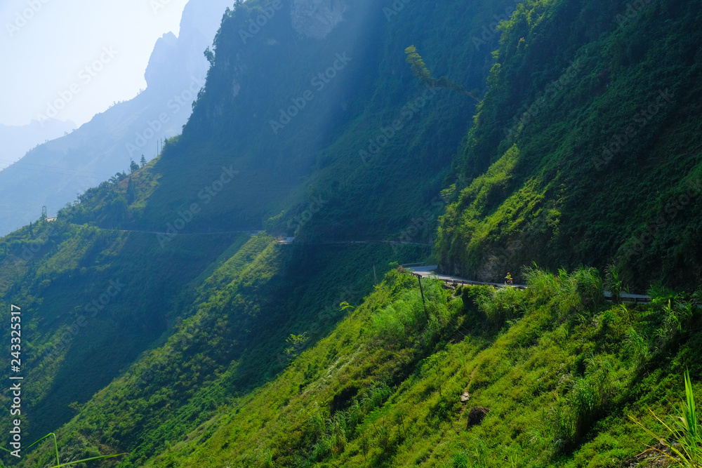 Winding roads through valleys and karst mountain scenery in the North Vietnamese region of Ha Giang / Dong Van. Winding roads through valleys and karst mountain scenery in the North Vietnamese region of Ha Giang / Dong Van.
