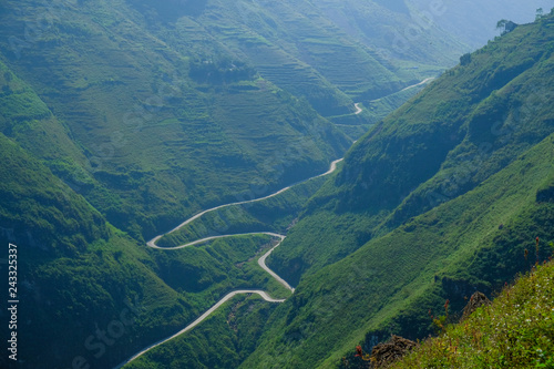 Winding roads through valleys and karst mountain scenery in the North Vietnamese region of Ha Giang / Dong Van.