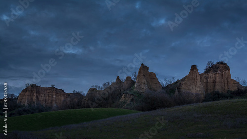 landscape with mountains and clouds, le balze del valdarno in tuscany at blue hour