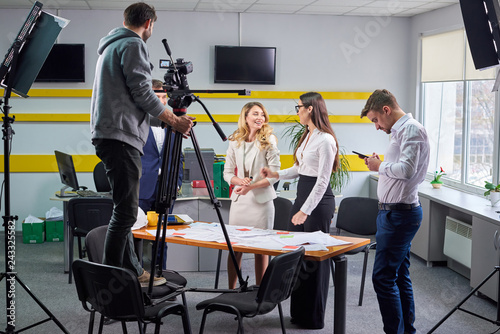 Film director discussing movie plan with the actors photo