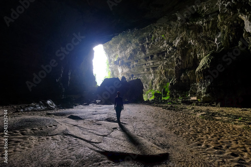 Woman entering the Hang Tien cave in the Phong Nha Ke national park in Vietnam.