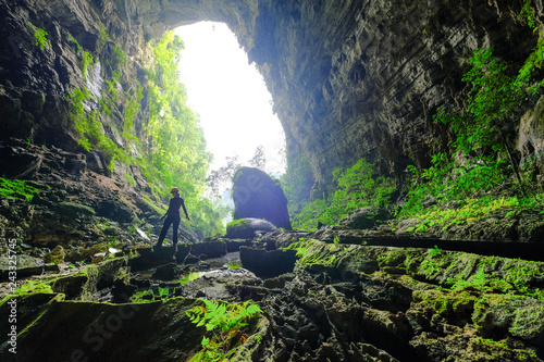 Woman entering the Hang Tien cave in the Phong Nha Ke national park in Vietnam.