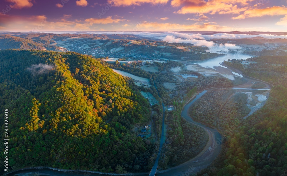 Colorful sunrise over Bieszczady mountains and Solinka river - aerial photography.