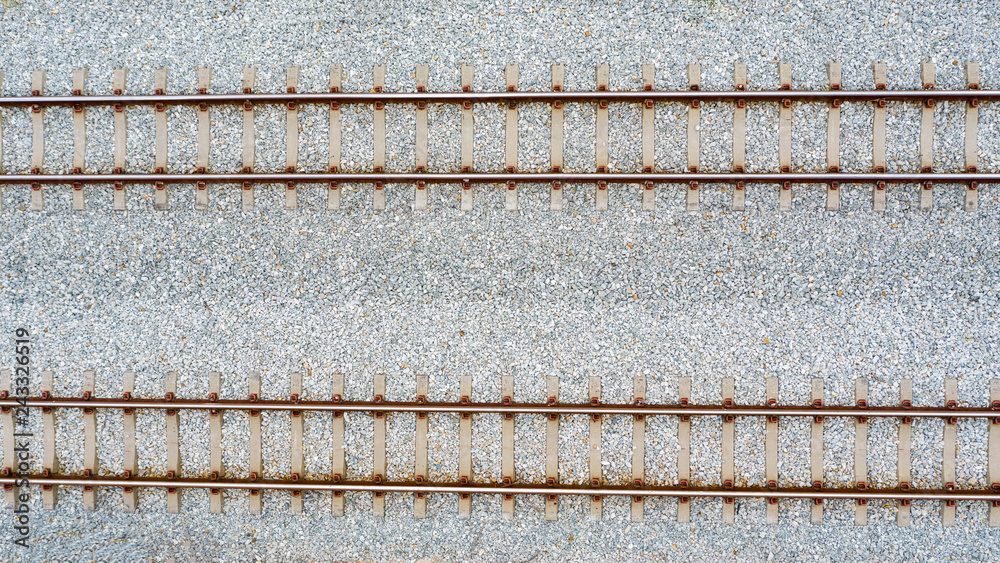 Top view of railroad tracks and abstract background