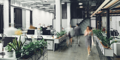 modern open space office interior with blurred business colleagues photo