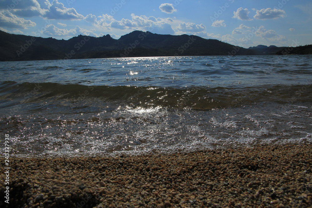 The sand and the lake in the mountains