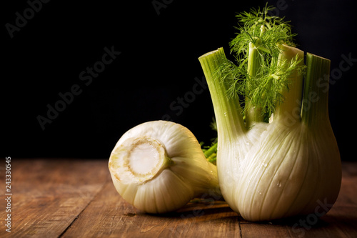 ripe fennel root on a black photo