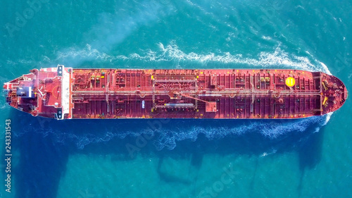 Large crude oil tanker roaring across The Mediterranean sea - Aerial image. photo