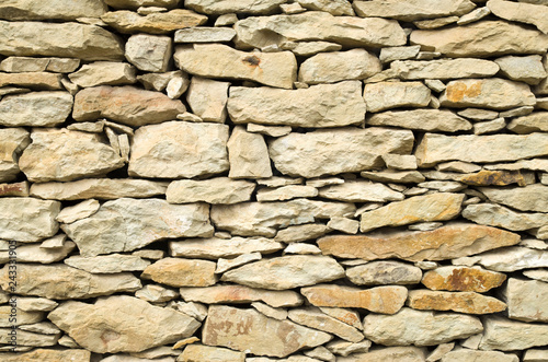 Old relief limestone wall closeup